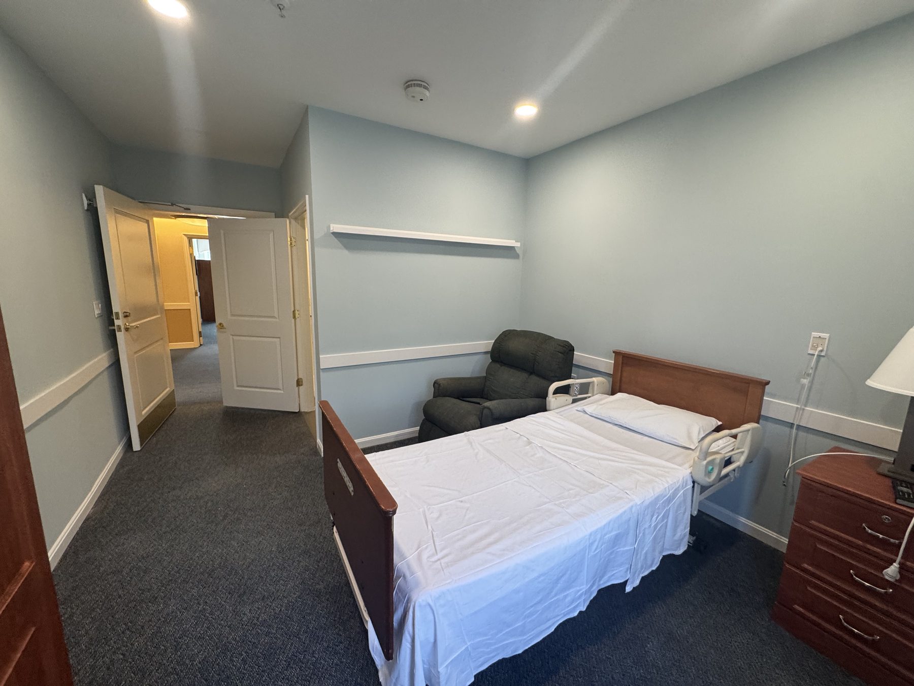 Renovated resident room and corridor entry in an Annapolis-area healthcare facility