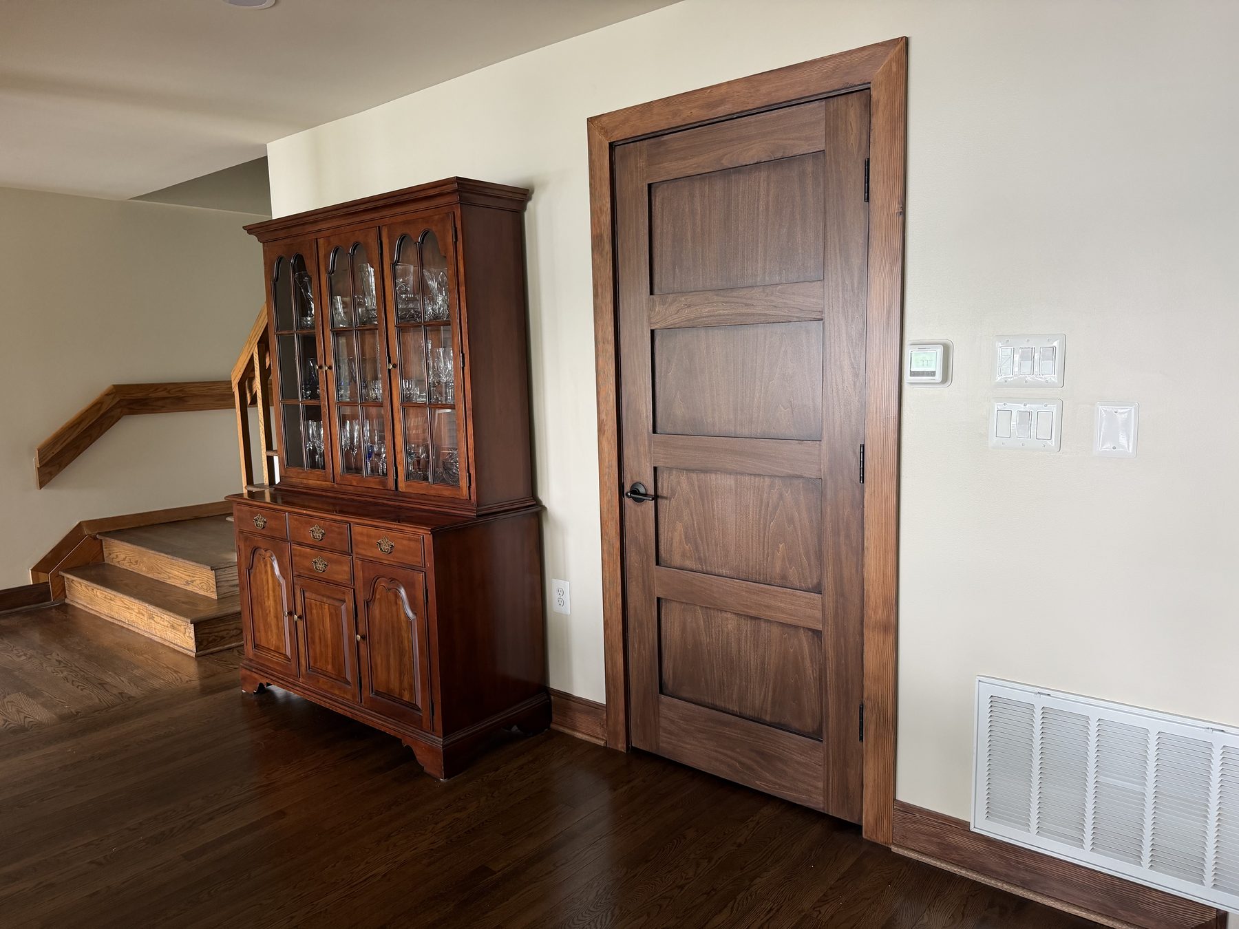 Solid walnut passage door and matching stair trim